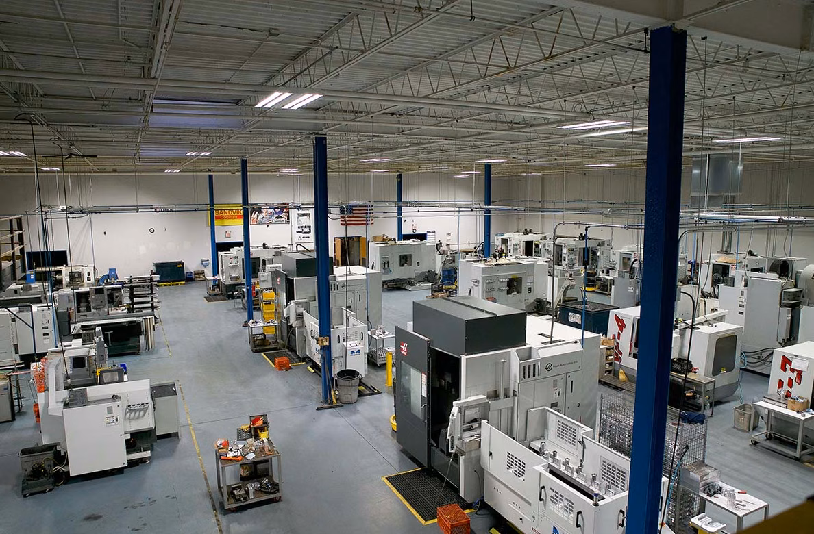 FIMS shop floor — multi-axis CNC operations under coolant
